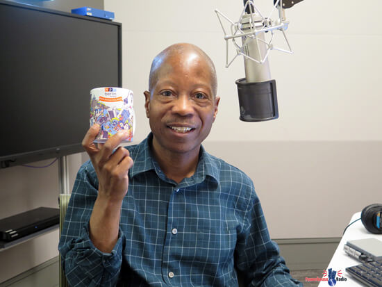 Kingsley H. Smith holding a 104.5FM Berlin Mug